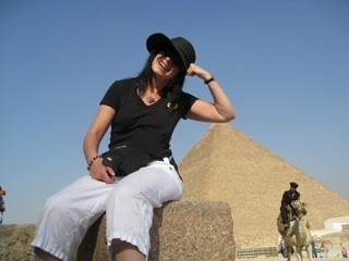 a person sitting on a stone ledge